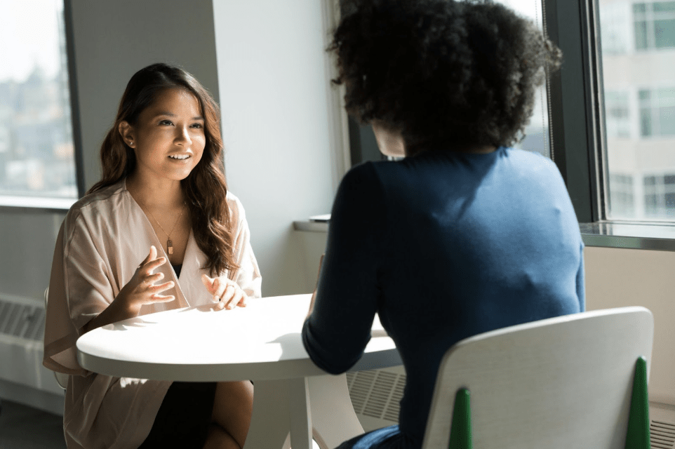 Organizational Ombuds - Two women speaking at a table